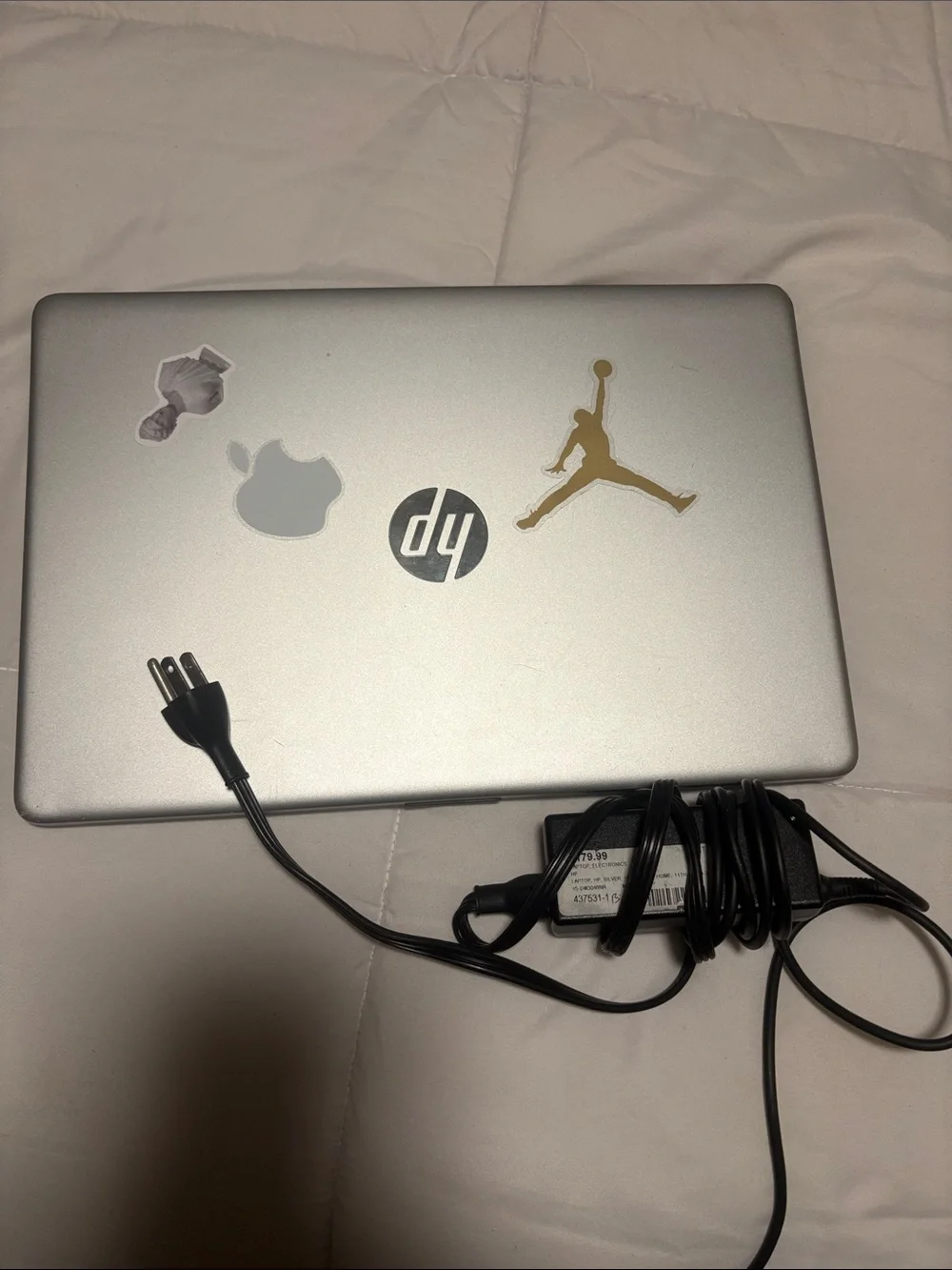 HP Silver Laptop with Charger and Sticker Accents